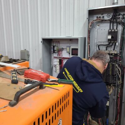 Congleton Services pulling wire to a 20 bus block heater controller in Mitchell Indiana school